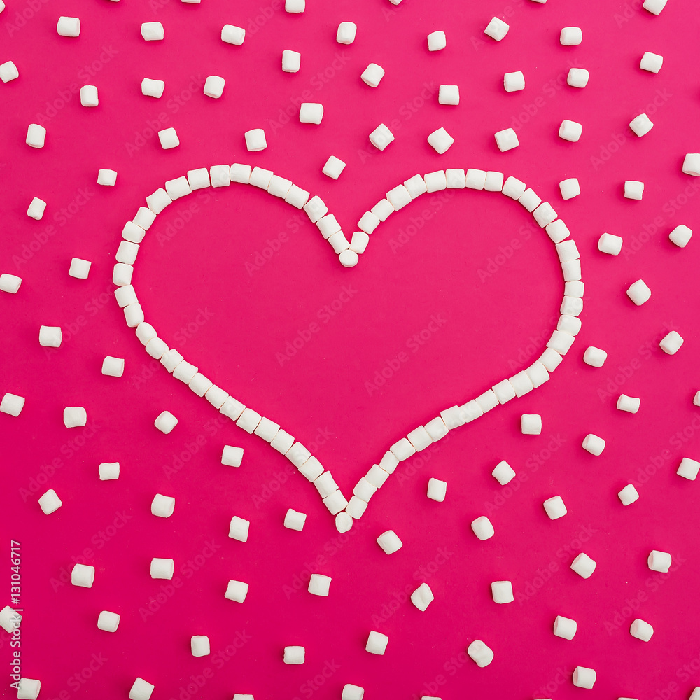 Marshmallows on pink background. Heart. Flat lay. Top view