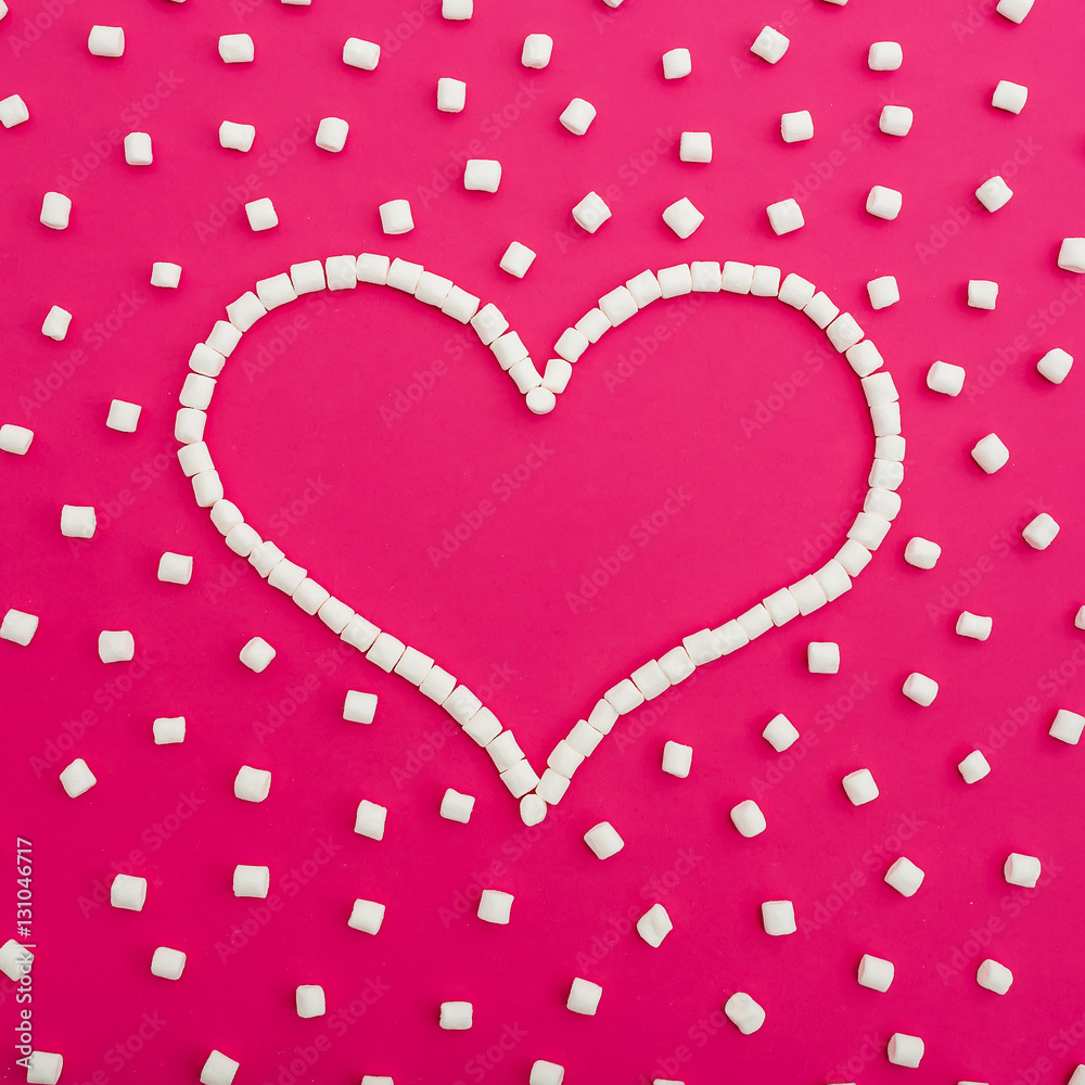 Marshmallows on pink background. Heart. Flat lay. Top view Marshmallows on pink background. Heart. Flat lay. Top view