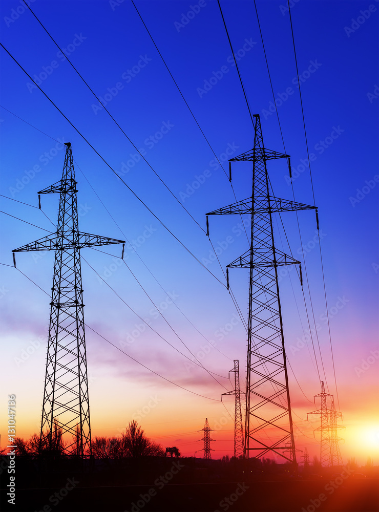 Fototapeta premium silhouette of high voltage electrical pole structure.