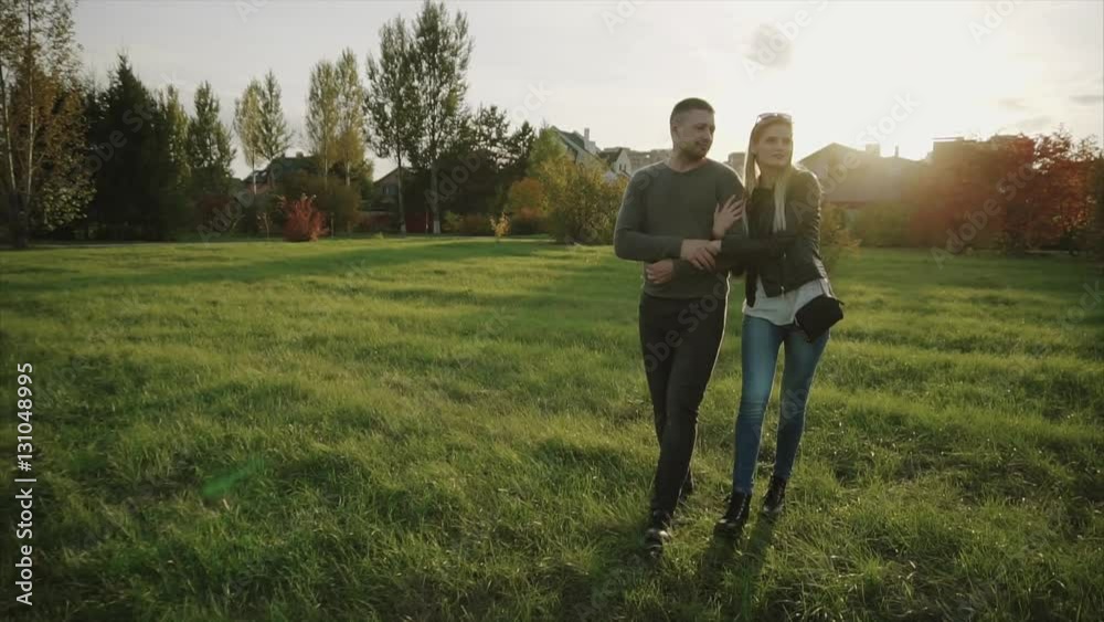 Couple walking in the autumn park HD Couple walking in the autumn park HD