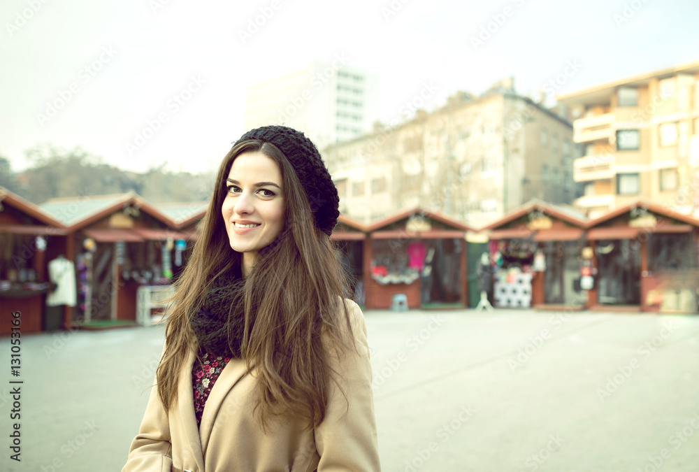 Smiling girl at christmas market in Sarajevo