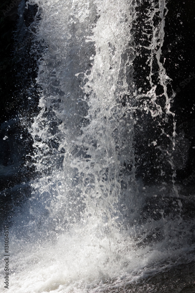 Waterfall stream. Black and white water spray