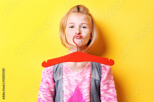 Funny teenager girl holding...
