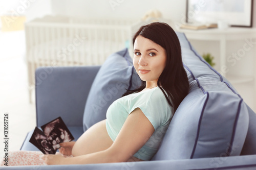 Young pregnant woman with u...
