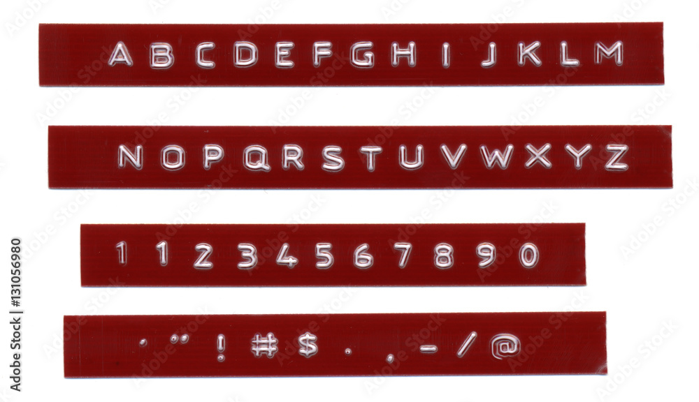 Embossed letters on red plastic tape Dymo