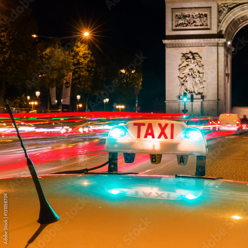 illuminated taxi sign of a Parisian taxi
