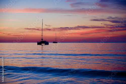 Sunset on the beach with ship and beautiful sky