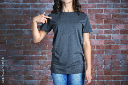 Young woman in blank grey t...