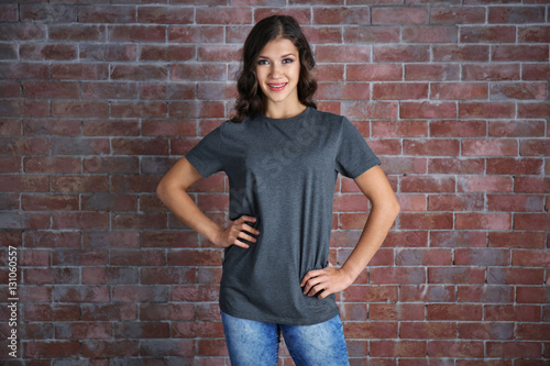 Young woman in blank grey t...