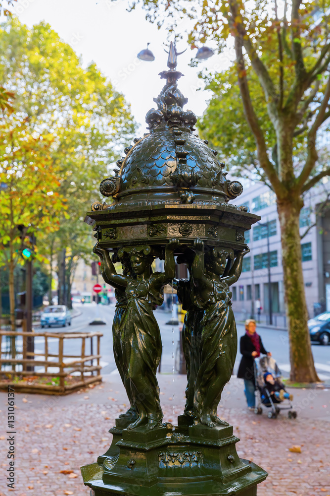 antique drinking fountain in Paris