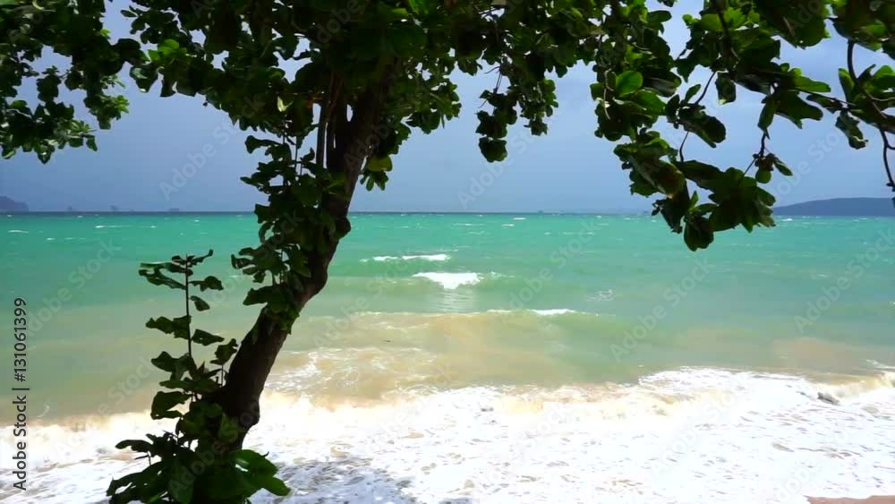 Windy and wavy sea before tropical storm in Krabi Thailand. Low season for traveling to ocean Windy and wavy sea before tropical storm in Krabi Thailand. Low season for traveling to ocean