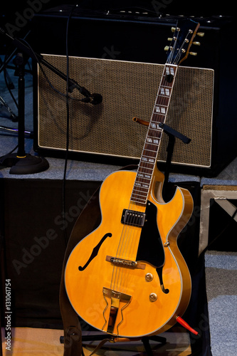 Electric guitar standing on stage