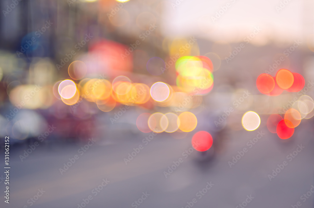 Blur traffic road with colorful bokeh light abstract background.