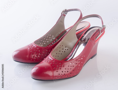 shoe or female red shoes on background.
