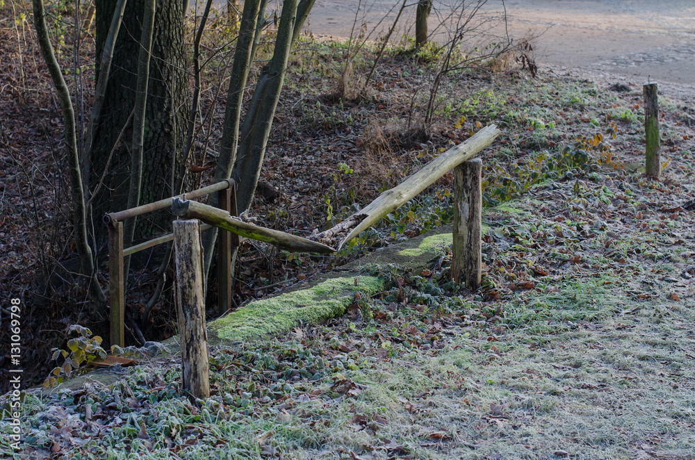 winter scene with a broken wooden fence in the countryside on a cold day winter scene with a broken wooden fence in the countryside on a cold day