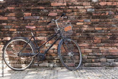 Old brick wall and Black bicycle