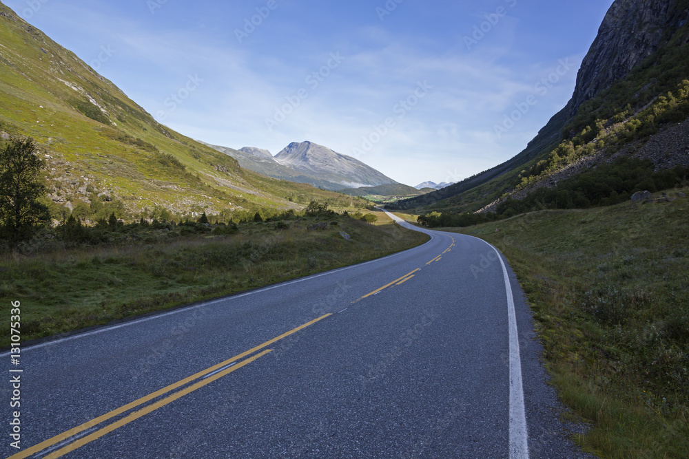 asphalt road through a picturesque mountain valley, Norway