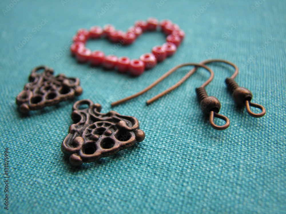 Red beads in form of heart, making earrings, handmade jewelry Red beads in form of heart, making earrings, handmade jewelry