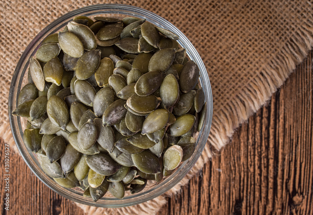 Pumpkin seeds on rustic background. Top view Pumpkin seeds on rustic background. Top view