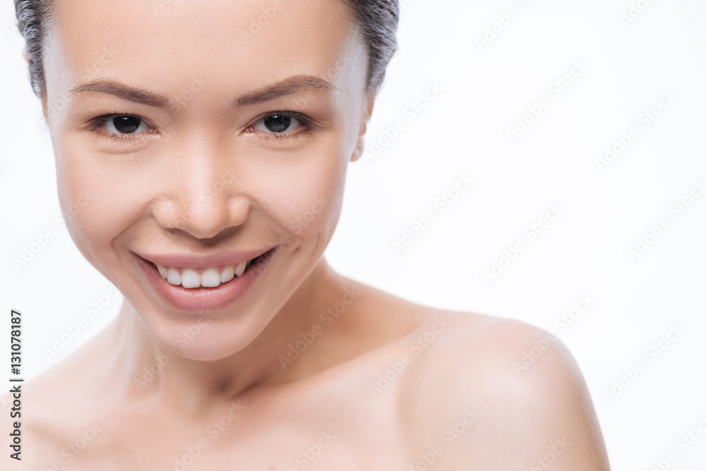 Obraz premium Smiling Korean woman expressing positive emotions in the studio