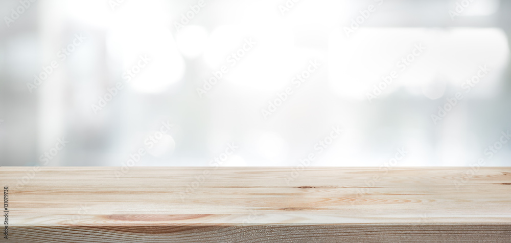 .Wood table top on blur glass window wall building background. - obrazy, fototapety, plakaty 