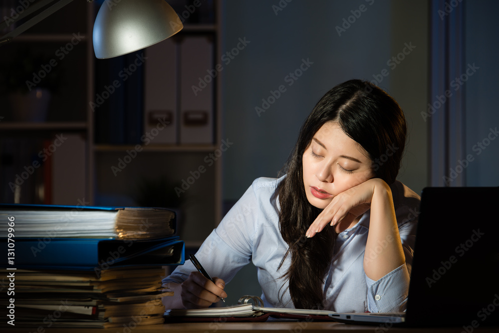 asian business woman sleepy working overtime late night asian business woman sleepy working overtime late night