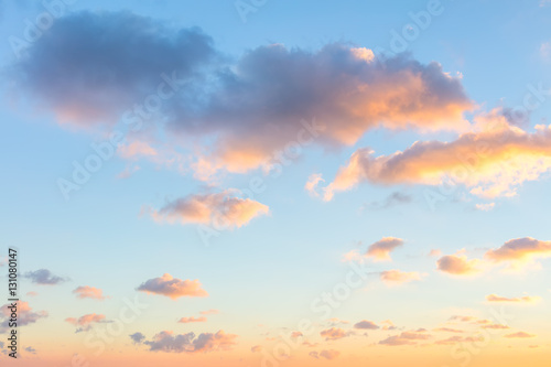 Gentle colors of sunrise sky with light clouds - background