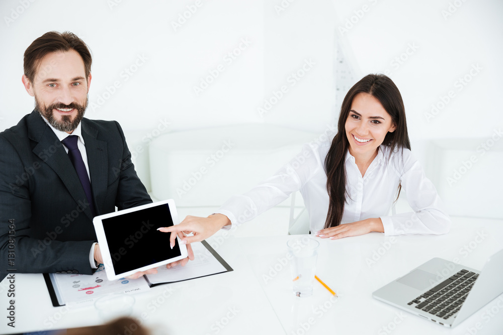 Business man showing blank tablet computer screen Business man showing blank tablet computer screen