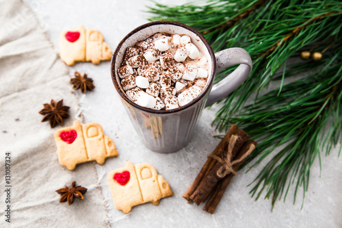 Cocoa with marshmallow and christmas decoration. On a stone back