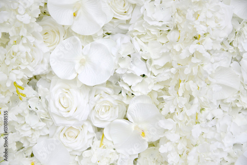Fototapeta Naklejka Na Ścianę i Meble -  Decoration artificial roses and orchids flower bouquet as a floral background with copy space.