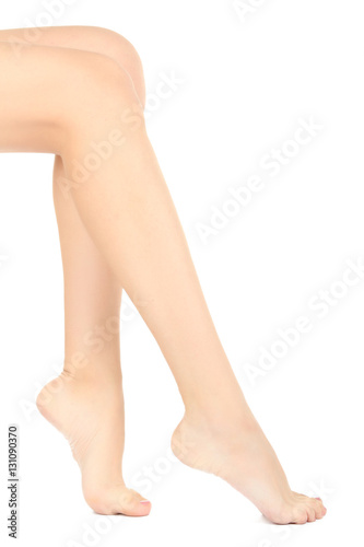 Beautiful female legs isolated on a white background.