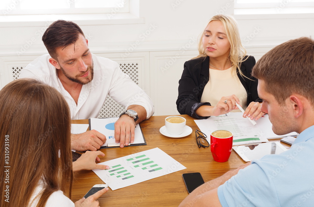 Business meeting. Young hipsters businessmen and women at modern Business meeting. Young hipsters businessmen and women at modern