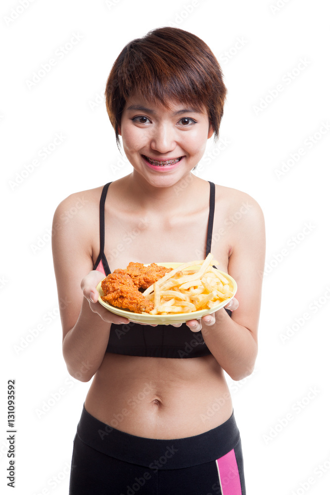 Beautiful Asian healthy girl with french fries and fired chicken