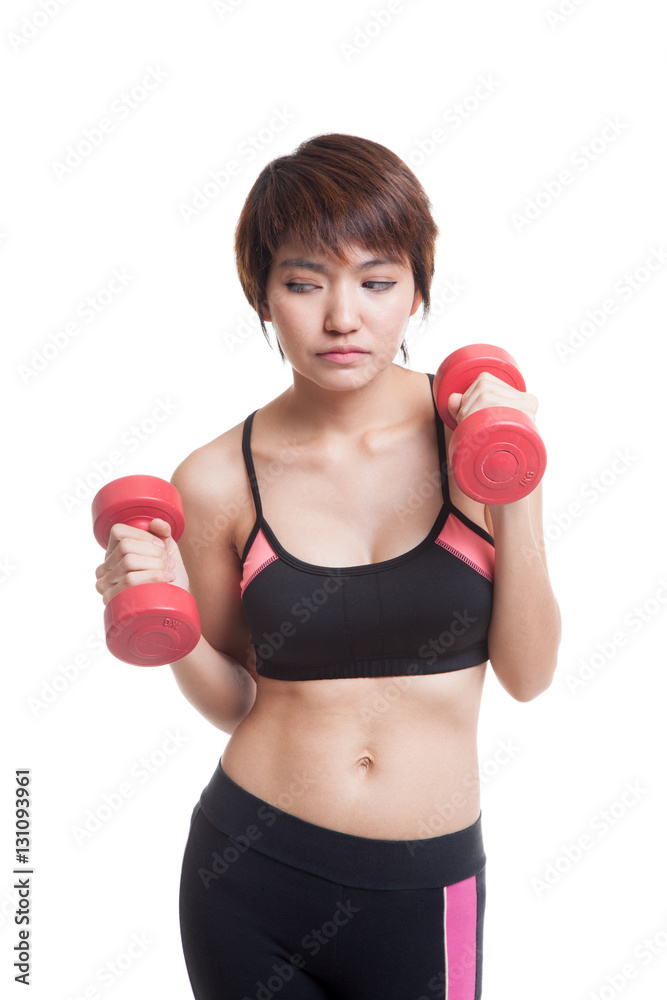 Tired Asian healthy girl exercise with dumbbell. Tired Asian healthy girl exercise with dumbbell.