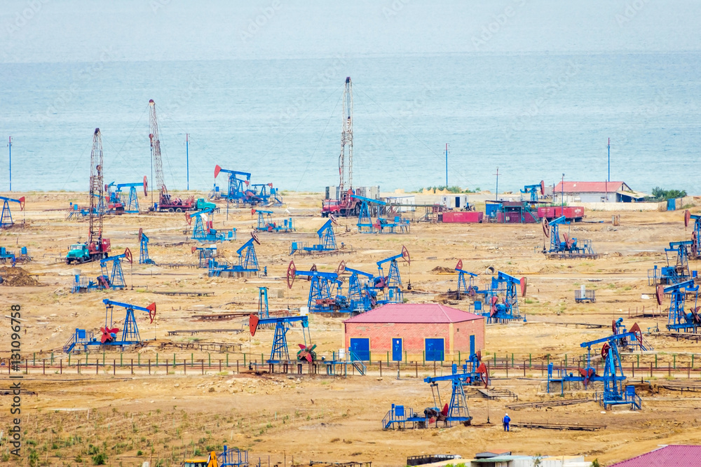 Oil pumps and rigs by the Caspian coast