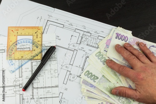 Money to build a house. Mortgage installment. Valid Czech banknotes. Part of architectural project, architectural plan, technical project, construction plan. 