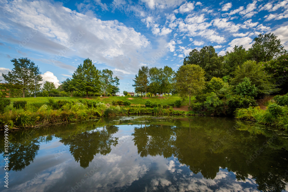 Dramatic sky over the lake at Symphony Park, in Charlotte, North