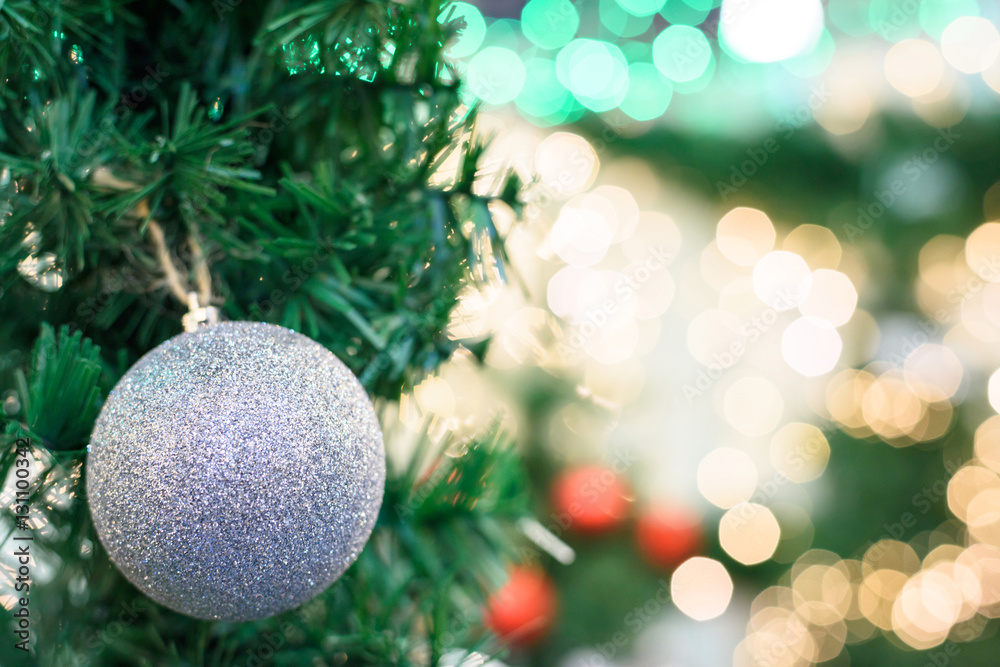 Christmas tree decoration with silver toy, red, green and yellow bokeh light dots, shallow depth of field Christmas tree decoration with silver toy, red, green and yellow bokeh light dots, shallow depth of field