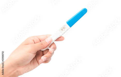 Woman hand holding pregnancy test with white background