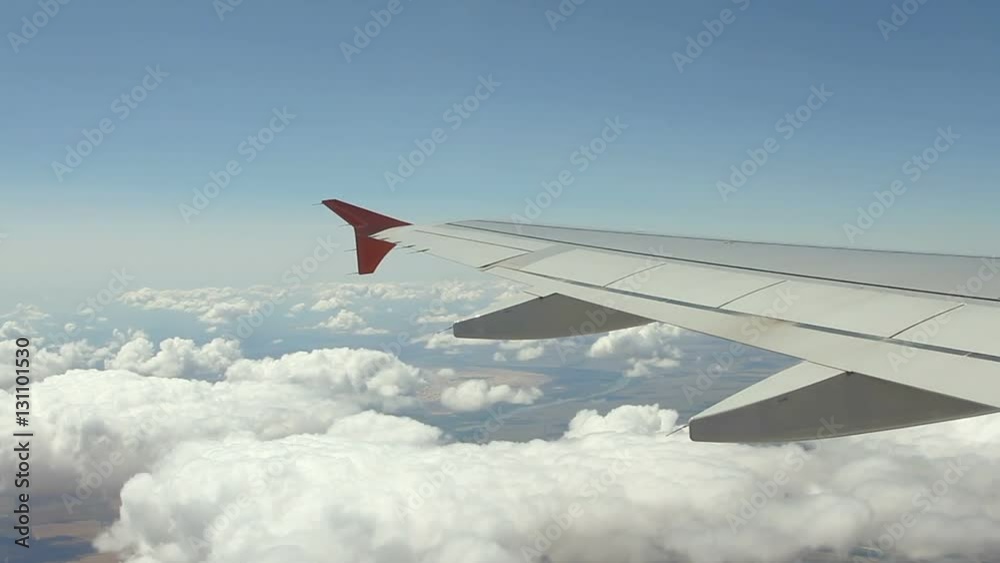View on the Wing of airplane from window View on the Wing of airplane from window