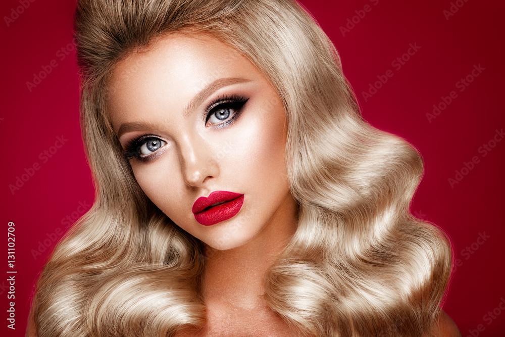 Fototapeta premium Beautyful girl with bright make up and beautiful hairstyle. Red lips