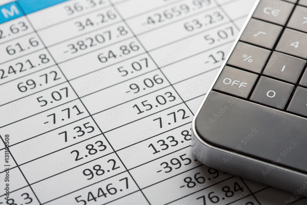 Close up of finance business sheet with calculator Close up of finance business sheet with calculator