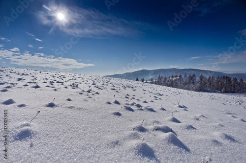 Słoneczny zimowy dzień w górskim mieście Muszyna. Sunny winter day in the mountain in Muszyna - Poland. Polish mountain landscape 