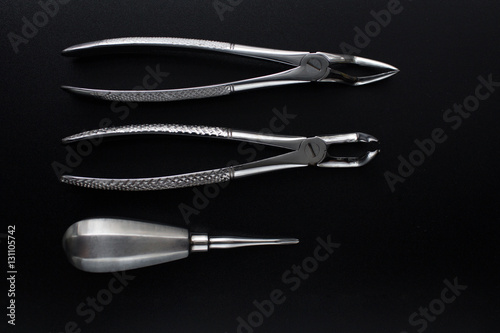 Set of metal dental tools for tooth extraction