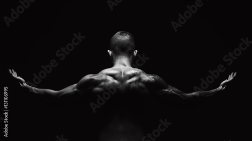 Unrecognizable man shows strong neck muscles closeup
