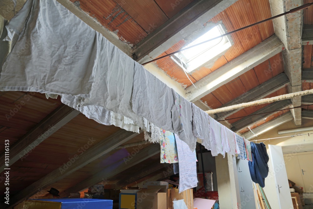 clothes hanging in the attic of a nursery