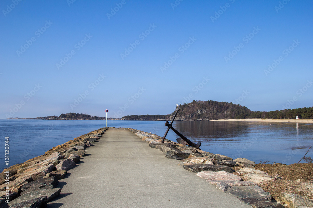 Landscape Scandinavian nature, the rocky shore of the lake, blue sky