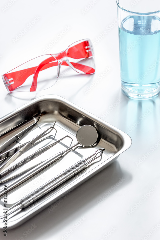 dentists tools in cabinet on white desktop dentists tools in cabinet on white desktop