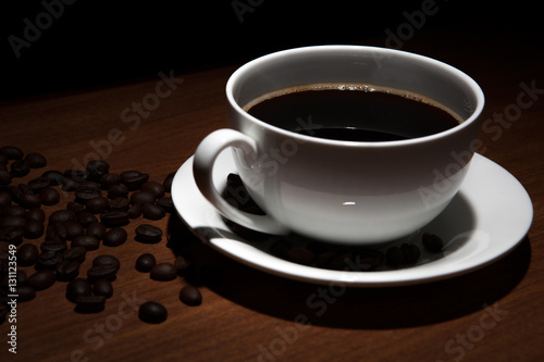 cup of coffee and beans on the table