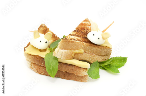 Toast with cheese decorated with white mice of quail eggs